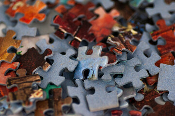 mixed puzzle pieces scattered on the table