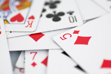 Intricate playing cards scattered on the table.