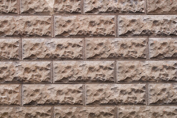 Gray decorative brick effect tiles on the facade of the house. Abstract brick wall background