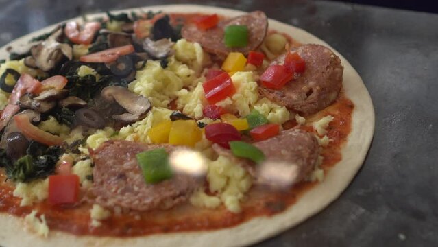 Fresh pizza dough with half and half topping spinash salami cheese prepare to go to bake oven
