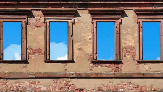 Clouds moving fast behind old stone windows ruin, cinemagraph loopable