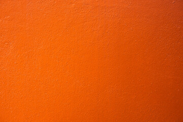 house wall painted orange. Orange wall texture background