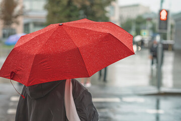 Abstract girl under red umbrella, modern city, rainy evening - obrazy, fototapety, plakaty