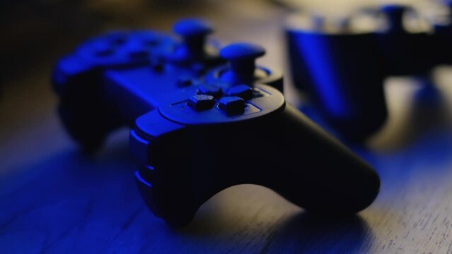 The joystick from the game console lies on the table, close-up