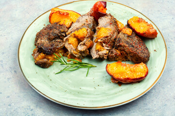 Grilled beef meat steak with peach.