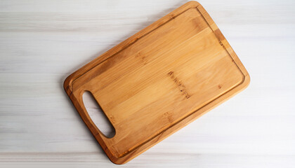 Cutting board on a white table. Pizza board.Kitchen wooden cutting board. Kitchenware. Menu. Recipe. The concept of cooking. Mockup
