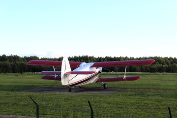 There is a small plane in a field.
