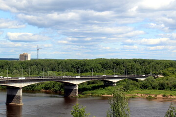 Fototapeta premium Summer landscape with a bridge over the river.