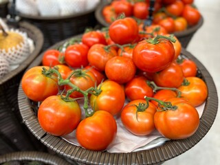 tomatoes in a basket at supermaket