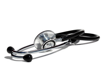 An iron stethoscope lies on a white isolated background.	