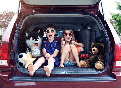 Children in Car with Luggage for Summer Vacation