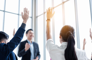 Business person raising hand during seminar. Hand up in conference asking to answer a question in...