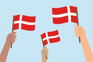 Diverse hands raising flags of Denmark. Vector illustration of Danish flags in flat style on blue background. - obrazy, fototapety, plakaty