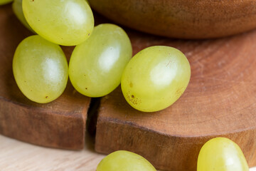 Homemade green unwashed grapes on a board