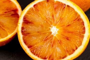 sliced orange with yellow-red juicy flesh