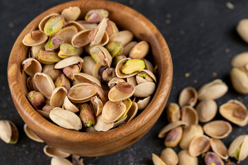 a large number of salty and crispy pistachios close-up