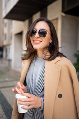 Portrait smiling middle age woman in sunglasses