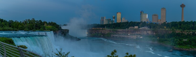 Large panoramic of Niagara Falls, NY and Ontario, Canada, water falls and viewing areas with...