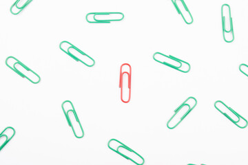 Top view of red paperclip with all green one, Leadership and extraordinary concept