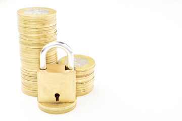 Coins with lock isolated on white background with clipping path, money security concept