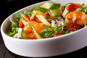 smoked salmon salad with cucumbers, cream cheese, arugula, basil