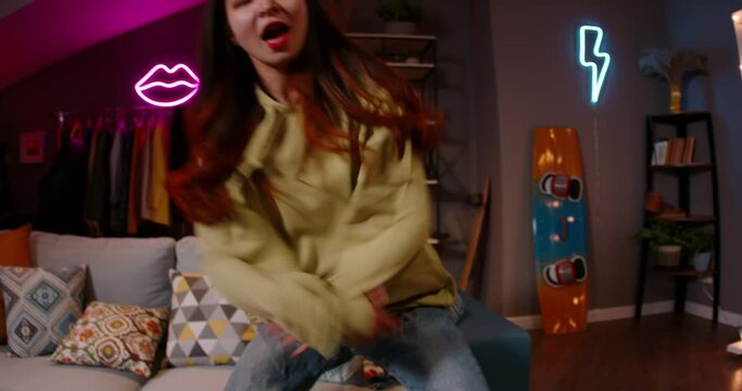 Asian female recording video of trending hip hop dance challenge for likes and followers on social media platform. Trending moving dance reel tiktok instagram app youtuber tik tok reels