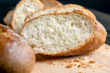 Deurstickers Cut white bread into pieces © rsooll