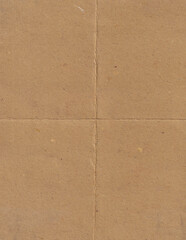 Brown carton with creases background. Textured paper with folded lines backdrop.