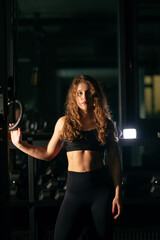Naklejka na ściany i meble Athletic Beautiful Woman at gym