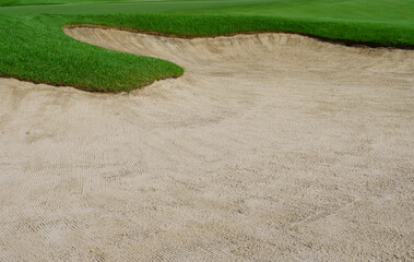 Golf Course Sand Pit Bunkers, green grass surrounding the beautiful sand holes is one of the most challenging obstacles for golfers and adds to the beauty of the golf course.