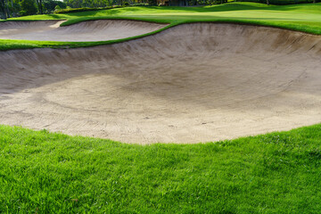 Golf Course Sand Pit Bunkers, green grass surrounding the beautiful sand holes is one of the most challenging obstacles for golfers and adds to the beauty of the golf course.