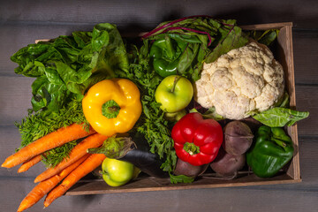 Farm organic market shopping concept, Wooden box with summer, autumn raw vegetables and fruits 