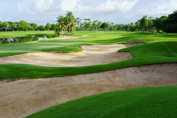 Golf Course Sand Pit Bunkers, green grass surrounding the beautiful sand holes is one of the most challenging obstacles for golfers and adds to the beauty of the golf course.
