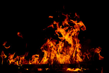 Fire flame burning and glowing on dark black background