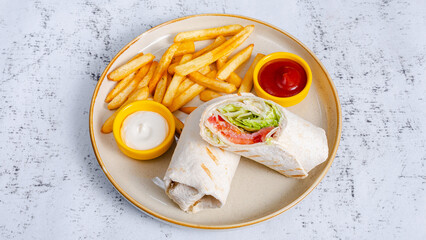 Chicken roll with french fries in plate