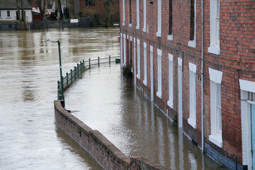 Flooding in Shrewsbury, the River Seven over tops it’s banks flooding nearby terraced houses. A result of Global warming and climate change having devastating  results for nearby  home owners.