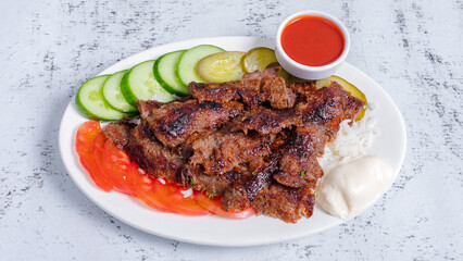 Beef portion doner kebab in plate top view