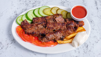 Beef portion doner kebab in plate top view