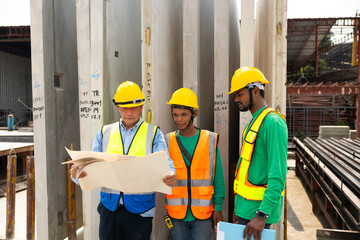 Group of Professional Mechanical Engineer man  team Working on construction blueprints paper at Prefabricated concrete factory Heavy industrial. Product quality Inspection. Unity and teamwork concept