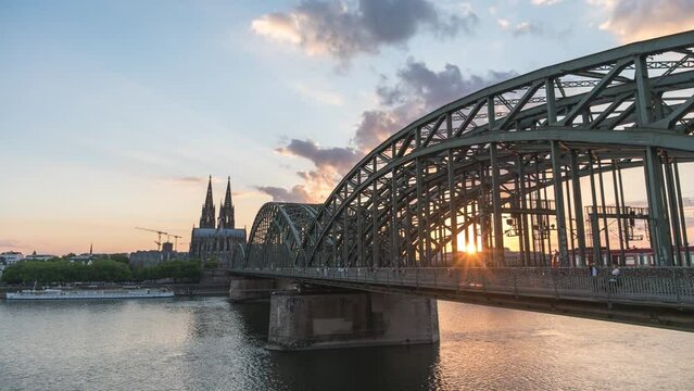 Cologne (Koln) Germany time lapse 4K, city skyline sunset timelapse at Cologne Cathedral (Cologne Dom) with Rhine River and Hohenzollern Bridge