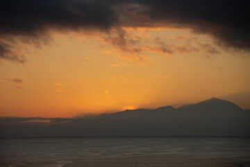Spectacular sunset from Puerto Rico, Gran Canaria, with Teide as a witness, Tenerife, Spain