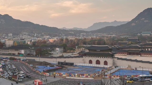 Seoul South Korea time lapse 4K, city skyline day to night timelapse at Gwanghwamun Square and Gyeongbokgung Palace in autumn