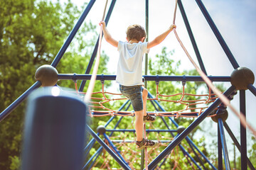 Kid exercise for health and sport concept. Happy child boy playing