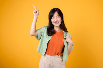 Unlock savings and shop now! young Asian woman in her 30s, wearing a green shirt on an orange...