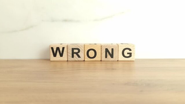 Word wrong made from wooden blocks. Error, business failure concept