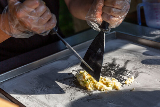 The process of making fried ice cream. Healthy fruit sweets. Popular tasty street food. Close-up.
