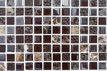 Background made of square small black and brown mosaic with copy space