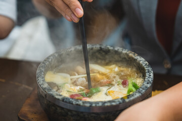 Bun Bo Hue, Bun Bo, Vietnamese beef noodle soup spicy in stone bowl