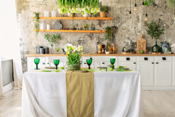 Interior design scandinavian kitchen with table. Cozy Wooden white cuisine decorated with flowers and decor. Kitchen utensils, dishes, plates on shelves. Stylish dining room with furniture	
