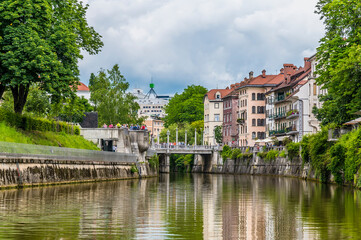 A view on the Ljubljanica River towards the Shoemakers Bridge and the center of Ljubljana, Slovenia in summertime